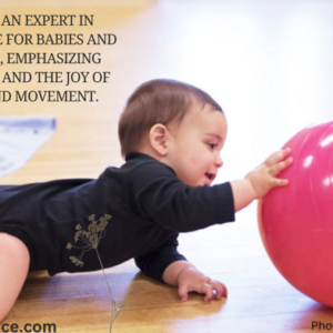 a baby reaches for a ball during Judith Nelson's baby braindance session